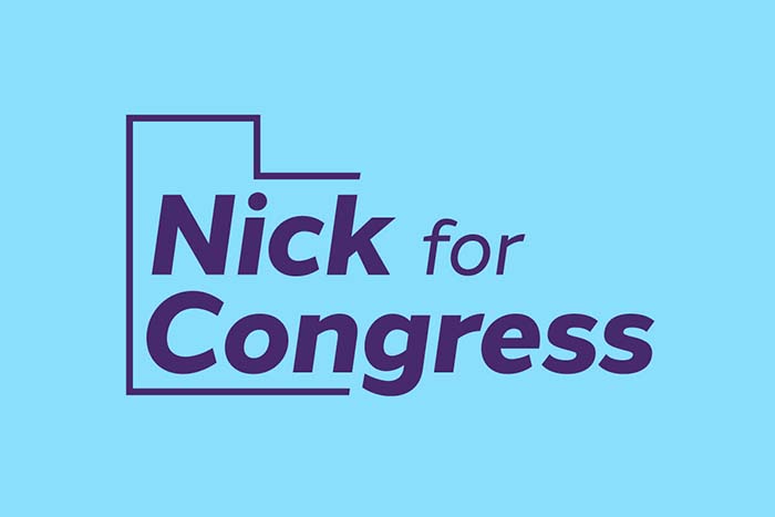 Purple 'Nick for Congress logo' on a light blue background
