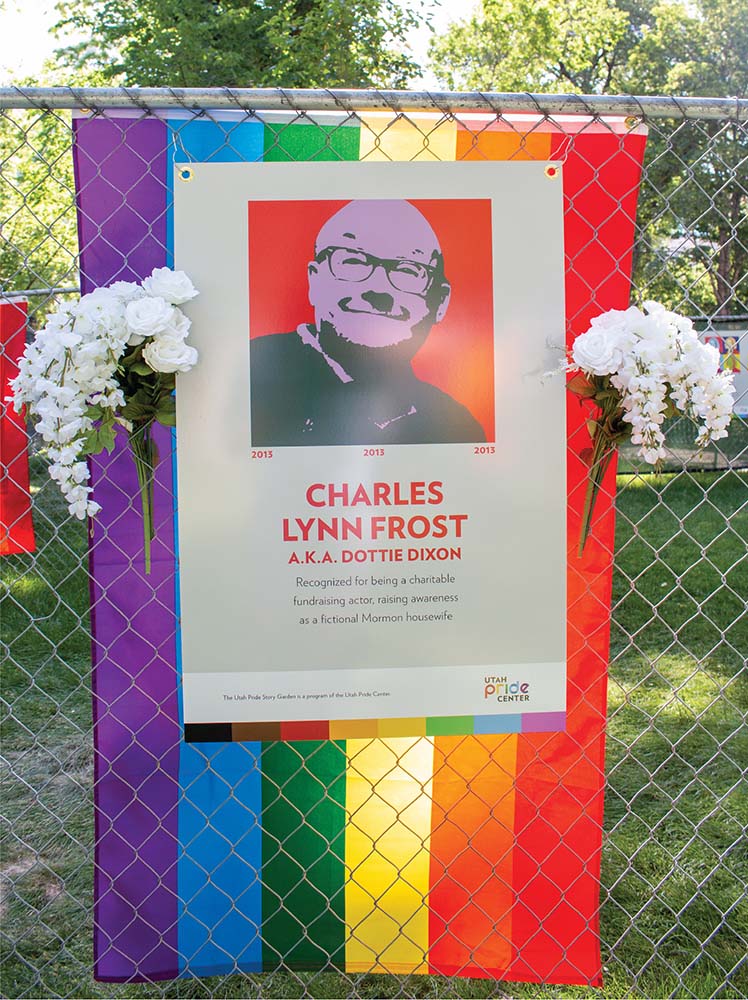 Panel with an illustration of Charles Lynn Frost with their name in front of a rainbow flag.