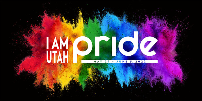 'I Am Utah Pride' in white on a rainbow color splash