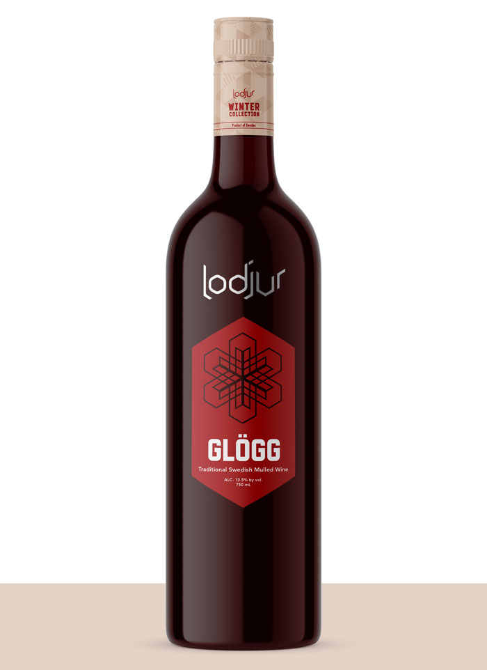 Lodjur bottle with a cranbery label with snowflake cutout and silver metallic lettering