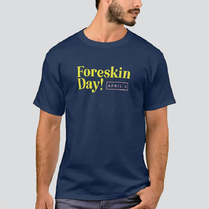 Man in a navy shirt that has the Foreskin Day logo in yellow