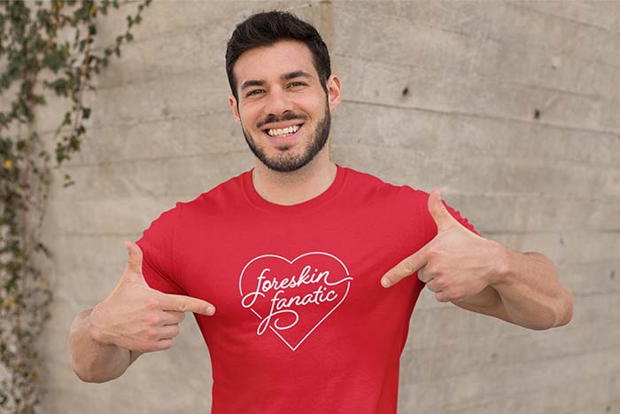 Man wearing a shirt with a large heart and the text 'Foreskin Fanatic'