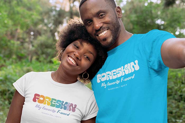 Two people wearing a shirt with a retro font saying 'foreskin, my favorite f-word'