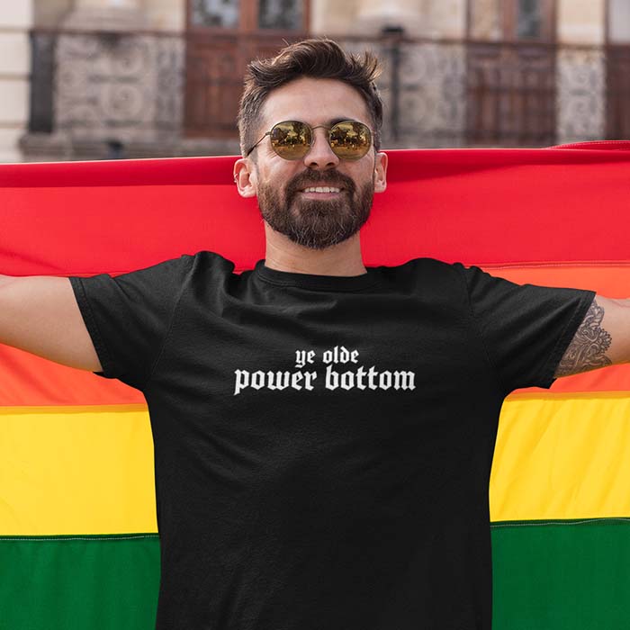Man wearing a black shirt that says 'ye olde power bottom'