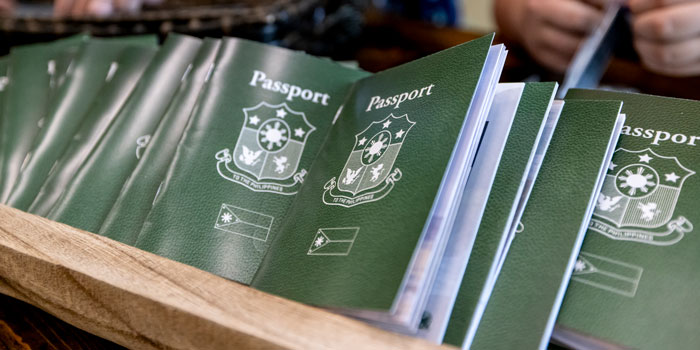 Several passports sitting in a basket.